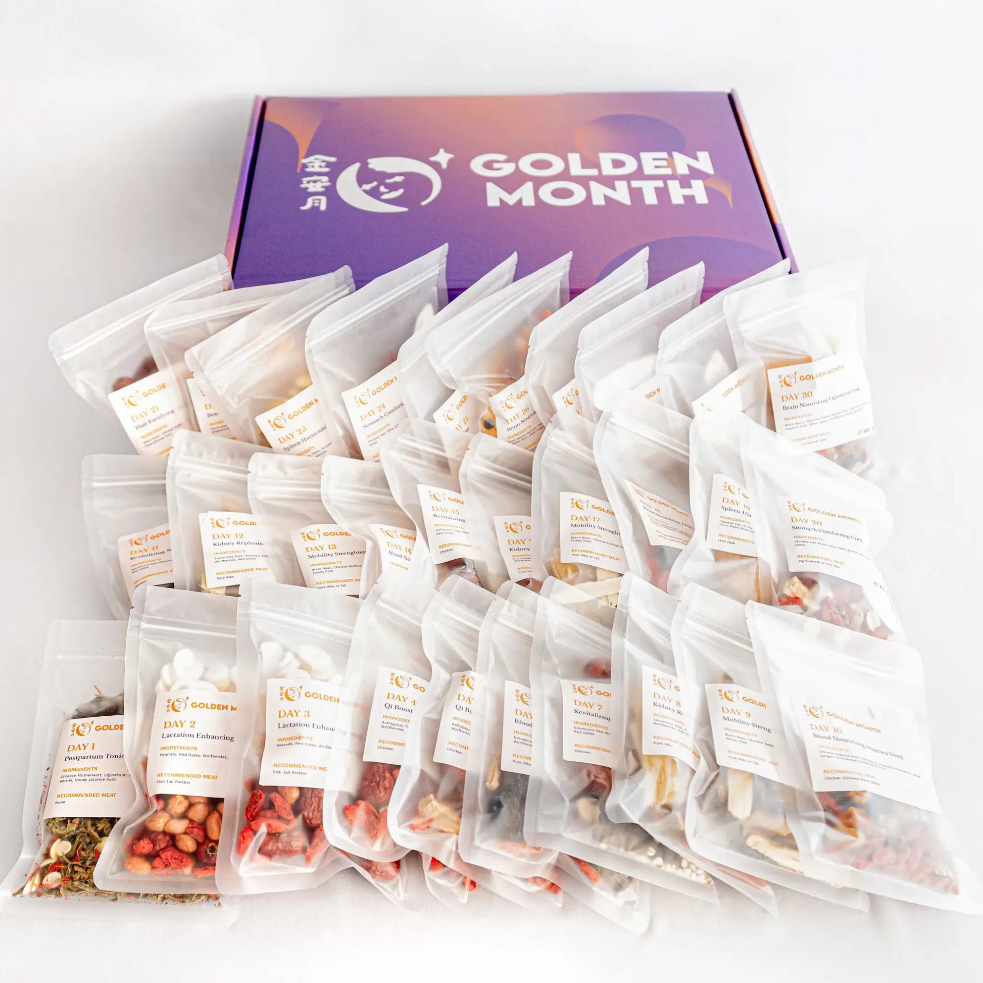 Multiple chinese postpartum soup packs in front of a 'Golden Month' branded box on a light gray background