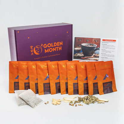 Tea packaging set with orange bags and a purple box labeled 'Golden Month' on a white background.