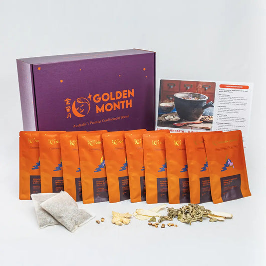 Tea packaging set with orange bags and a purple box labeled 'Golden Month' on a white background.