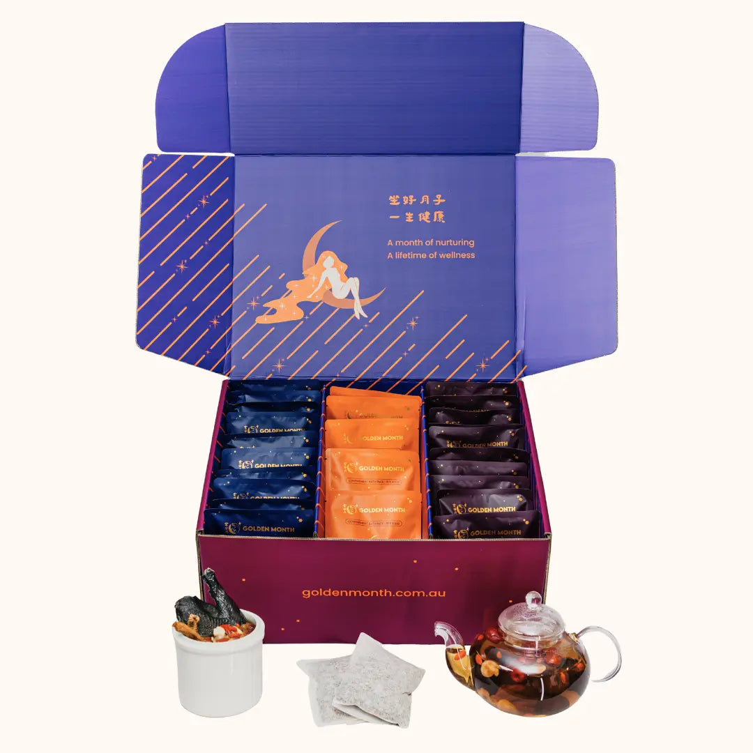 Confinement soup, tea and bath gift set with a purple box containing individual packages, a teapot, and other items on a white background.