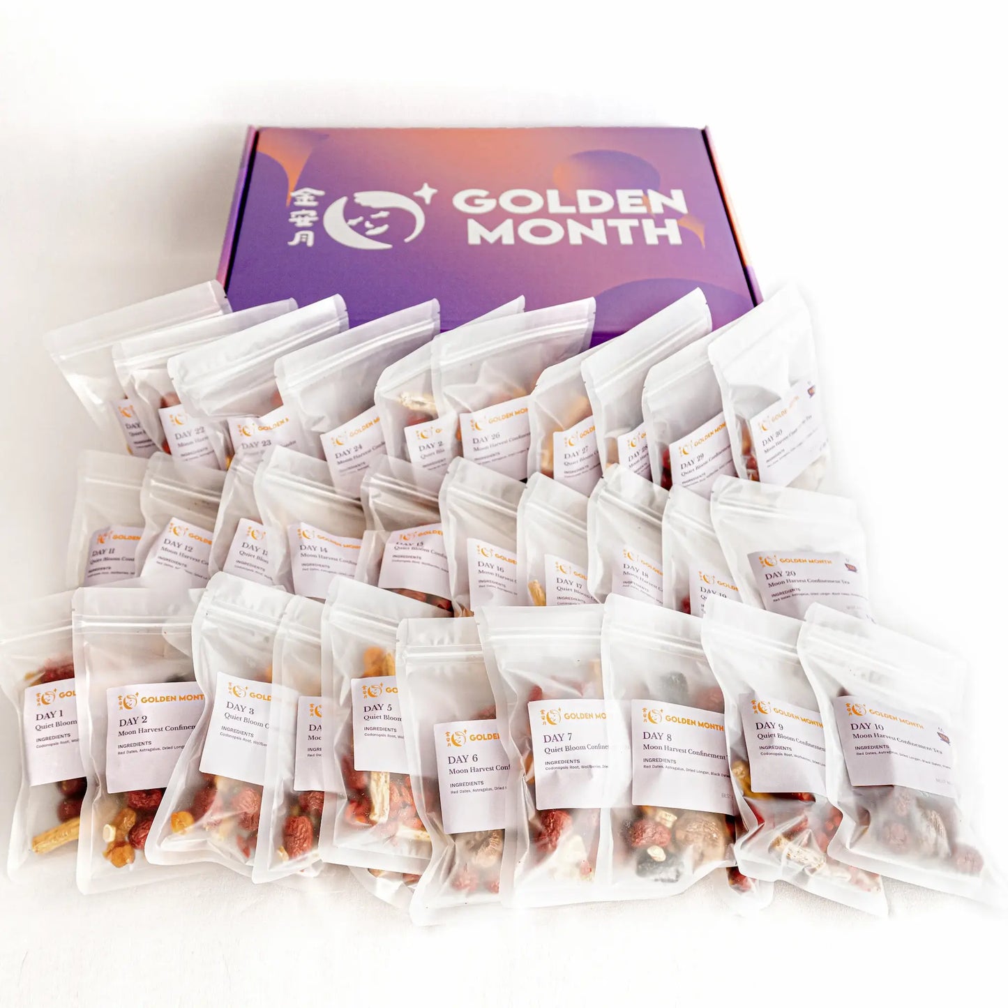 Multiple postpartum herbal tea packages in front of a purple box with 'Golden Month' branding on a white background