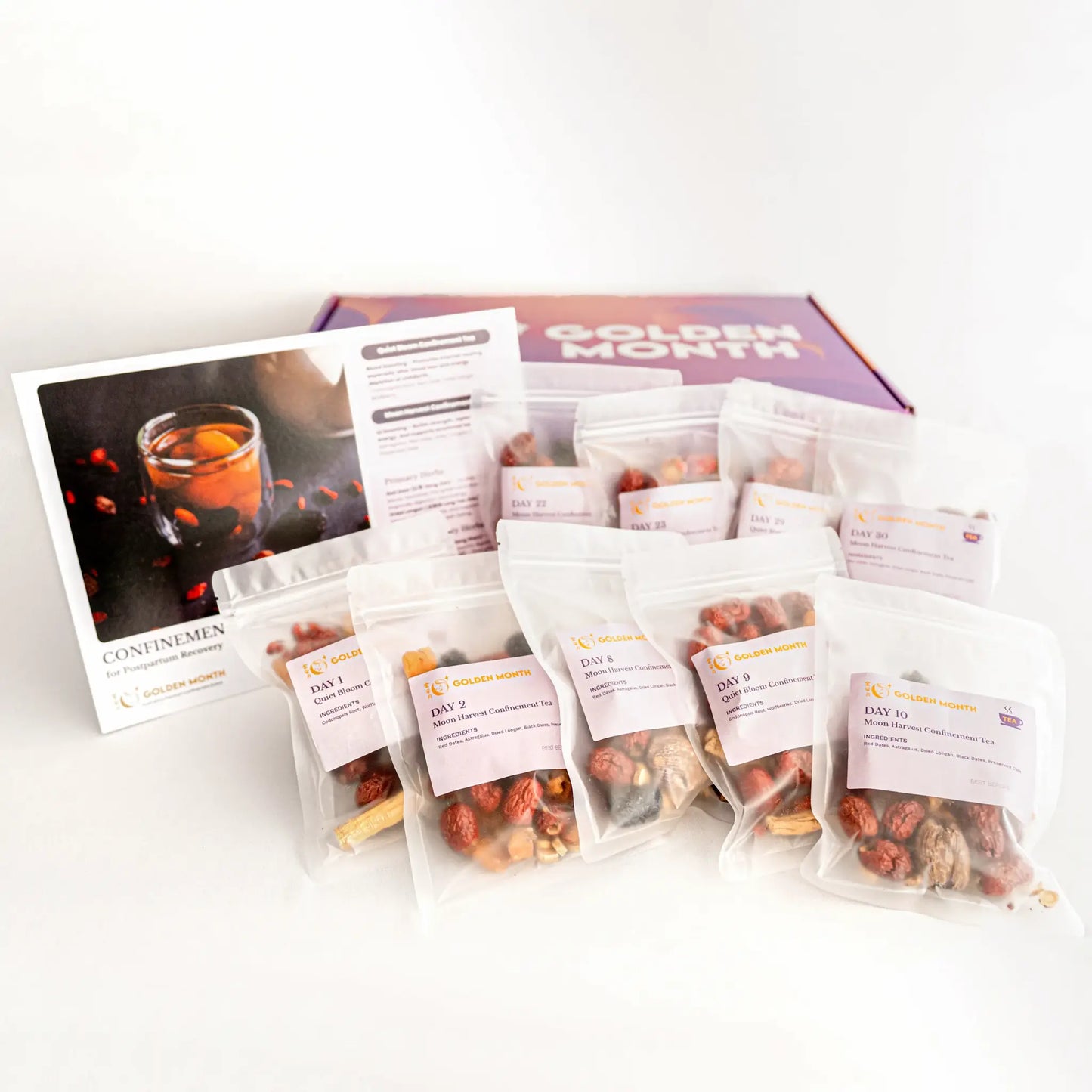Assorted confinement tea packages with a brochure on a white background