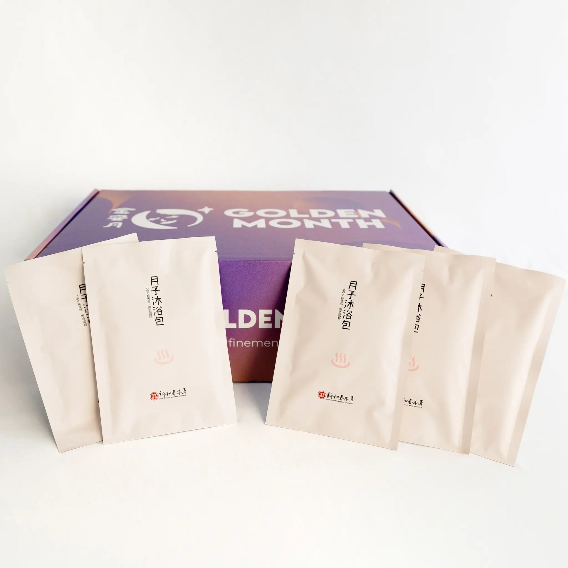 Packaged postpartum herbal baths packs with 'Golden Month' branding on a white background