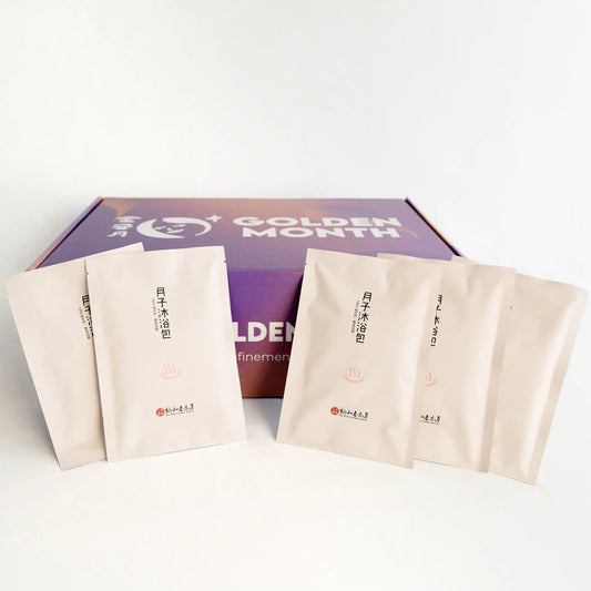 Packaged postpartum herbal baths packs with 'Golden Month' branding on a white background